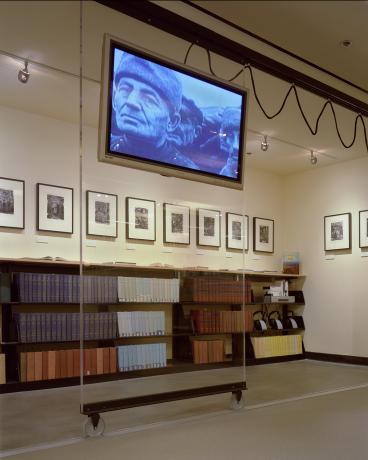 Photo of sliding TV on clear acrylic panel