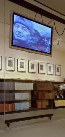 Photo of sliding TV on clear acrylic panel